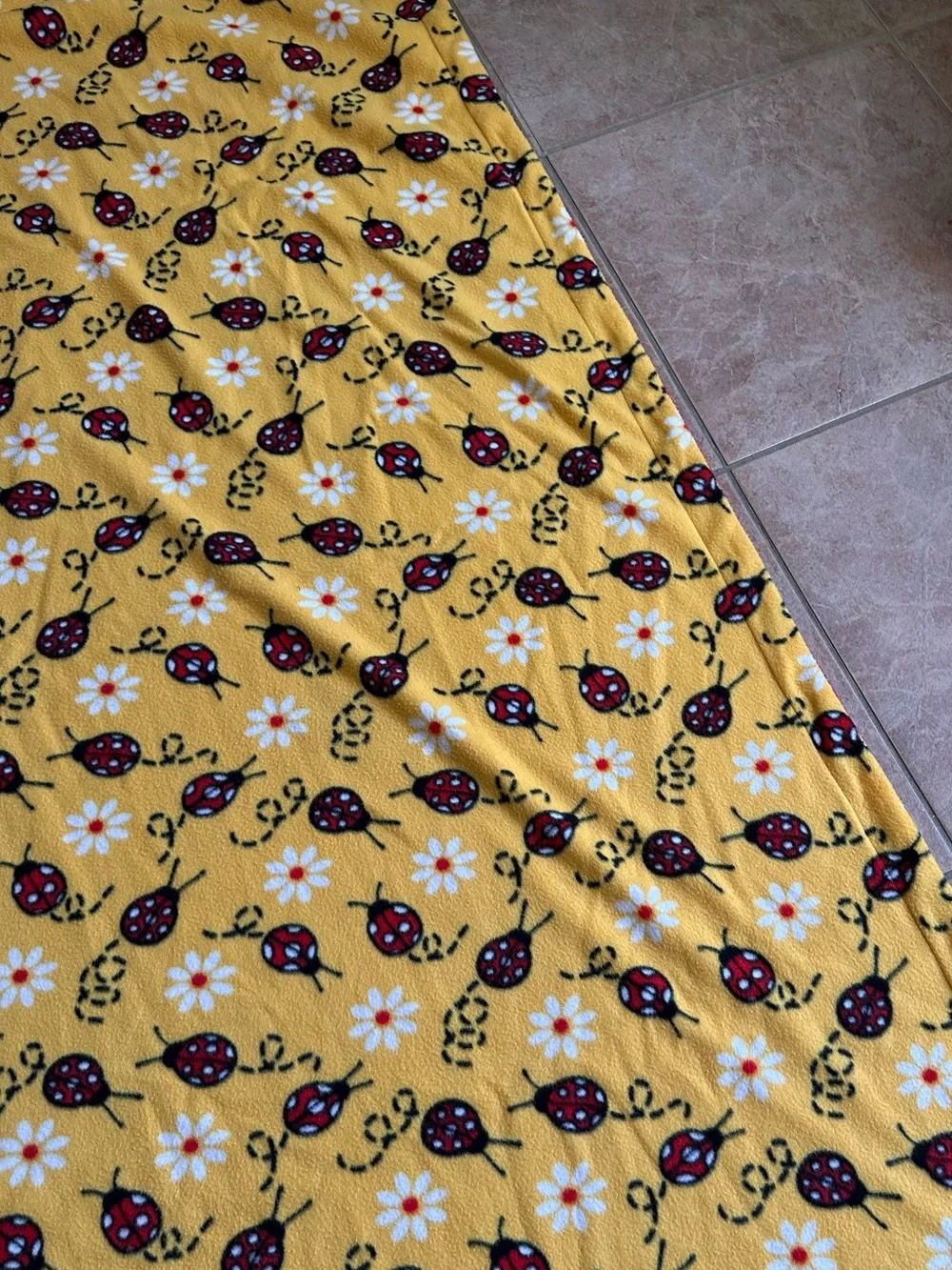 Soft Yellow Blanket with ladybugs and daisies